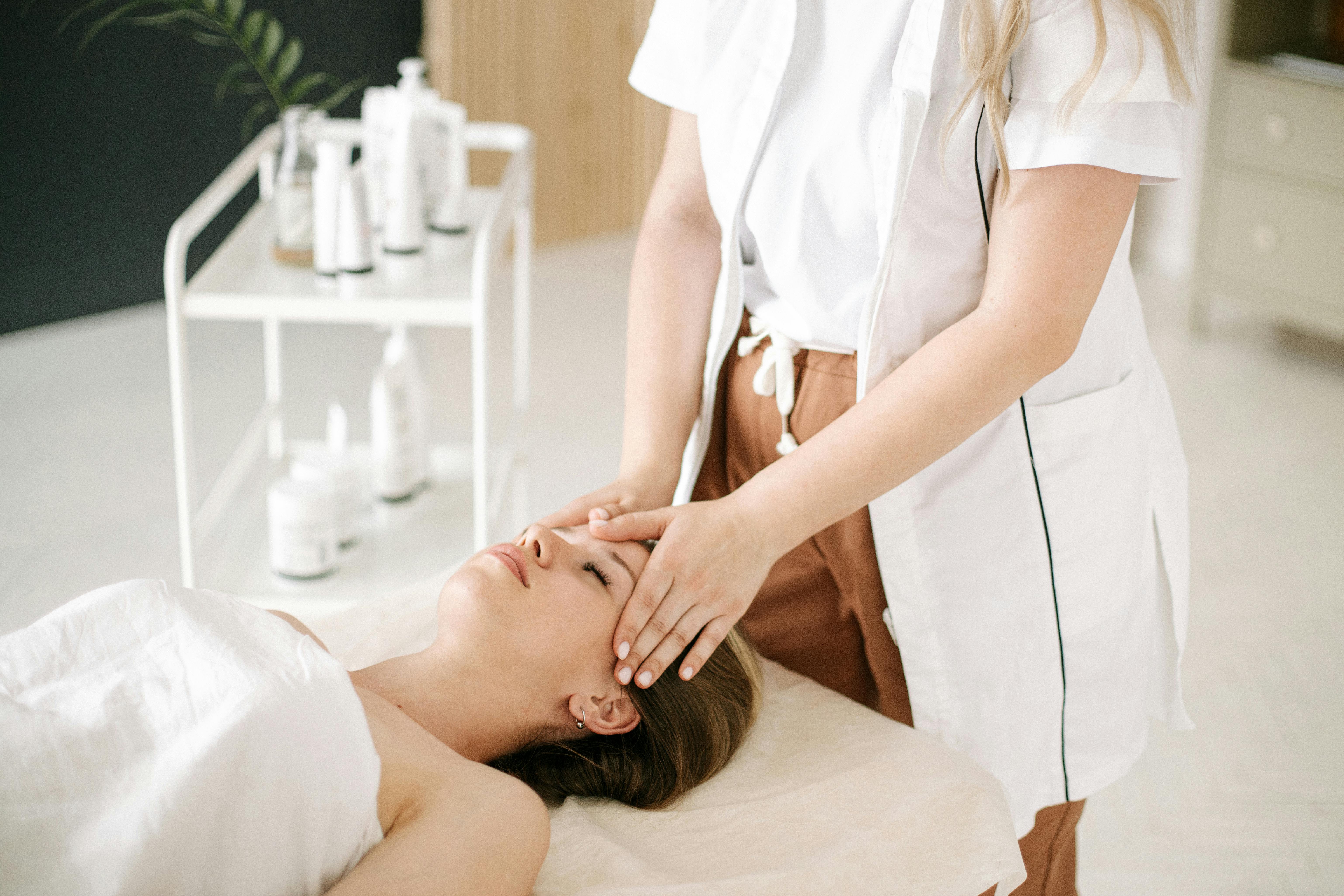 A serene head massage treatment in a spa room